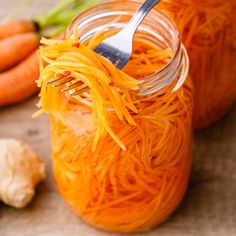 a fork is stuck into some food in a jar