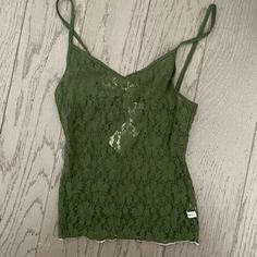 Authentic Hollister.Lace Tank. New With Tag. Size M. Very Rare. I Purchased This In The Early To Mid 2000s, Y2k Era. It Has Never Been Worn. I Just Found A Lot Of My Old Vintage Hollister And Abercrombie Items From That Era In My Storage Unit, Check Out My Other Listings If You're Interested In Brand New With Tag Unworn Vintage Hollister And Abercrombie From The 2000s. They Were Purchased From 2001-2007 Mostly. New With Tag Green Y2k Cami Top, Fitted Lace Casual Tank Top, Green Lace Camisole Top, Green Lace Cami Top, Casual Summer Lace Camisole, Casual Fitted Lace Camisole, Fitted Lace Camisole Casual Style, Green Lace Tops For Spring, Green Casual Camisole With Lace Trim