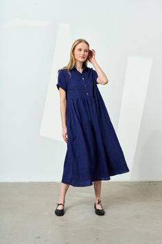 Long, loose linen dress with a classic shirt collar. This pleated linen dress has a high waist and is gathered at the waistline that makes it comfortable for many body types. Suitable for expectant and nursing mothers, due to its looseness and button fastening in the front. Sleeves end above the elbows and can be rolled up, if you prefer a shorter version. Side pockets add extra convenience. Wear this maxi linen dress with any flat footwear - sandals, sneakers or ballet flats. STYLE DETAILS * Lo Linen Collared Dresses With Buttons, Blue Linen Button-up Dresses, Collared Linen Daywear Dresses, Collared Linen Day Dress, Collared Linen Dress For Daywear, Short Sleeve Linen Maxi Dress For Work, Dress With Shirt, Maxi Linen Dress, Flat Footwear