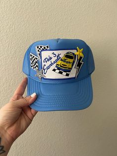 This cute trucker style hat is the perfect gift! Very unique patch style trucker hat! Snag one for you or a friend! 😊 PLEASE NOTE that the size of patches & placement may slightly differ than the hat pictured. My patches are sourced from multiple different places & may not always be exactly as shown but I do my best to keep them as close as possible  **Listing is for HAT ONLY ❤ CUSTOM: We're happy to create something custom for you! Please just send a message with your idea & we will work toget Trucker Hat 5-panel As Gift, Trucker Hat As A Gift, Trucker 5-panel Hat As Gift, Retro Snapback Hat As Gift, Retro Cap Hat As Gift, Fun Blue Flat Bill Hat, Fun Trucker Hat With Patches And Curved Brim, Trucker Mini Hat With Curved Brim, Trucker Style Baseball Cap With Patches