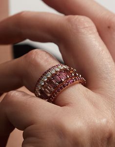 A luminous ring, with rubies. A unique stacking ring, a subtle wedding band, or a wedding band and engagement ring all in one. 14K sustainable gold Center: 0.07ct ruby baguette 0.29 tcw round rubies Dimensions: Band width 1.9mmDelivery: Please allow up to 1-2 weeks for delivery. For rush orders please contact our Concierge. Baguette Ruby Ring, Heavy Rings For Women, Ruby Ring Stack, Stacked Eternity Bands, Opal And Ruby Ring, Wedding Stack Rings, Rose Gold Ring Stack, Stacking Wedding Rings, Ring Placement