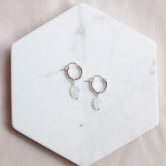 Everyone's favorite, moonstone, is a gorgeous milky white color that is sure to be a favorite. These earrings are just made to be worn every day! Details: Hoops measure 12 mm Sterling Silver or Gold Fill And Arlen supports Leap Girl Africa, aiming to end gender-based violence in Cameroon. Find out more here. White Moonstone Earrings For Daily Wear, Minimalist Nickel Free Moonstone Earrings, Minimalist Nickel-free Moonstone Earrings, Everyday White Jewelry With Moon Charm, Everyday White Moon Charm Jewelry, Everyday White Teardrop Hoop Earrings, Birthstone Jewelry Mothers, Holiday Stocking, Forever Jewelry