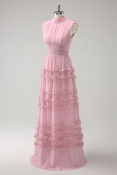 a pink dress on a mannequin with ruffles around the waist and neckline