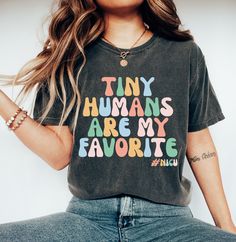 Tiny Humans Are My Favorite T-Shirt, Tiny Humans Lover Gift, Teacher T-Shirt, Kindergarten Shirt, Tiny Humans Shirt, Elementary Teacher, Trending Shirt, Unisex Soft Cotton Tee Welcome to my store! I will help you to have a good shopping experience as much as I can. If you have any request (design customization, more size and color options) please feel free to message me. I will reply as soon as possible. I have listed some information to help you below:  HOW TO ORDER  * Please, Check and Review Teacher Shirts Elementary, Nanny Activities, Preschool Teacher Shirts, Kindergarten Teacher Shirts, Kindergarten Shirts, Kindergarten Teacher, Preschool Teacher, Gift Teacher, Tiny Humans