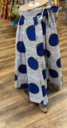 African skirt for women. It has a ribbed elastic waist band with ties on the side to help make a comfortable fit for multiple sizes. The full length skirt has deep pockets. This skirt is 37 inches long and will never go out of style. Don't delay order yours today.