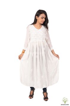 Highlights 100% Handcrafted Product Color: White Kurti Fabric: Muslin Neck: Round Neck Sleeve Length: 3/4 Sleeves Package Contains: 1 Chikan Embroidered Kurta Gown Care Instructions: Regular Machine Wash, Do not bleach, Gentle Machine Wash Description Following the Anuna chikankari one-of-a-kind aesthetic, this long fit and flare chikankari kurta has been handcrafted in Muslin cotton fabric and features Round Neck with Full sleeves. Pair this with palazzos or denim and get the world go gaga about your style! White Cotton Dress With Cutdana, White Self Design Dress For Navratri, White Self-design Dress For Navratri, White Straight Kurta Dress With Self Design, White Chikankari Embroidery Maxi Dress, White Anarkali Dress With Self Design, White Maxi Dress With Chikankari Embroidery, White Mulmul Long Sleeve Dress, White Cutwork Dress For Festive Occasions