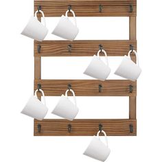 tea cups hanging on a wooden rack with hooks