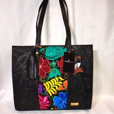 Brand New W/Tags! Angelozano Chisel Engraved Black Leather Tote With Floral Loom Work! Premier Mexican Designer Angelozano Produces Bags That Are Hand Made And Support Fair Trade Artisans. The Artisans Express Their Emotions And Feelings In The Looms, And When We See Them, They Transmit To Us A Part Of Their Life, Their Environment And Their Culture, That Is Why All The Looms Are Different Just As Our Personality Is Unique. By Using This Original Bag You Are Carrying A Unique And Unrepeatable Wo Black Hand Tooled Bags For Everyday Use, Black Hand Tooled Tote Shoulder Bag, Black Hand Tooled Rectangular Shoulder Bag, Artisan Black Bag With Leather Handles, Artisan Black Bags With Leather Handles, Artisan Black Bag For Daily Use, Black Hand Tooled Tote Bag, Black Hand Tooled Shoulder Bag For Everyday, Artisan Black Leather Bag