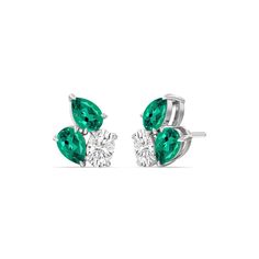 You won't regret treating yourself to this fuss-free wardrobe staple. These diamond and created emerald cluster earrings will easily fit in with many different looks. Each earring features three stones set close to each other: two of which are pear-shaped and set in opposite directions, and one oval-shaped secured by four prongs. Luxury Green Jewelry With Diamond Accents, Luxury Diamond Earrings With Gemstones, Cluster Jewelry, Blue Wedding Band, Light Jewelry, Gorgeous Engagement Ring, Diamond Anniversary Rings, Ring Ideas, Emerald Earrings