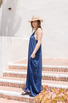 Capture the effortlessly cool vibes of summer in the Ryker Maxi Dress. Made from crinkled gauze, this navy dress features a flattering v neckline, adjustable shoulder straps, and convenient side pockets. Perfect for summer vacations! Details + Fit: 100% Rayon Runs True to Size Hand Wash Cold Hang Dry V Neckline Sleeveless Adjustable Shoulder Straps Side Pockets Crinkled Gauze Design Navy | Solid Model is 5'4" and wearing a size Small/Medium Gauze Maxi Dress, Cool Vibes, Summer Vacations, Maxi Dress Navy, Navy Dress, Maxi Dress, Navy, How To Wear, Design