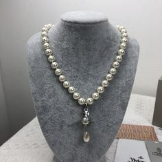 "Brand New Vivienne Westwood Pearl Necklace In Gold Brand New, Never Worn, Nwot 100% Authentic The Approx : L 19'' Comes With Gift Box, Gift Bag, And Dust Bag,Brand Cards,Instruction Manual,Jewelt Cloth. Full Packing As Inculded. Necklace Packed In Secure Packaging For Transit Welcome To Share And Offer. Thanks So Much." Westwood Pearl Necklace, Vivienne Westwood Pearl Necklace, Vivienne Westwood Jewelry, Vivienne Westwood Jewellery, Gold Branding, Instruction Manual, Box Gift, Bag Brand, Vivienne Westwood