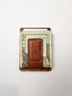 The Teddy is a minimalist front pocket wallet, made for durability and functionality. The wallet also features two side pockets and a hidden middle pocket which can hold extra cards. The Metal Money Clip is removable and can slide in and out of its pocket. The Magnetic Money clip option will hold up to 10 bills comfortably. The choice is yours! *Money in pictures is not included. Material: Full-Grain American Leather Dimensions: 3.8in x 2.75in Holds 4-6 cards and some bills. Handcrafted in Alaba Front Pocket Wallet, Clip Wallet, American Leather, Pocket Wallet, Money Clip Wallet, Slide In, Color Textures, Money Clip, Front Pocket