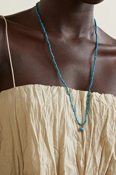 Andrea Fohrman's necklace is strung with vibrant turquoise beads complemented by a dangling pendant featuring a larger version of the stone topped with a diamond-encrusted star. It's handmade from 14-karat gold and has a generous length perfect for layering with the brand's shorter styles. Turquoise Lariat Hand-strung Jewelry, Turquoise Hand-strung Lariat Jewelry, Hand-strung Turquoise Lariat Jewelry, Turquoise Lariat Beaded Necklaces, Turquoise Lariat Necklace With Beaded Chain, Turquoise Beaded Chain Lariat Necklace, Blue Lariat Jewelry Hand-strung, Turquoise Long Necklace With Dangling Beads, Turquoise Beaded Long Necklace With Dangling Beads