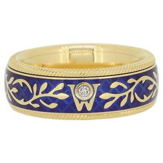 Here we have an 18ct yellow gold ring from the German jewellery designer, Wellendorff. The ring features two sections which allows the band to freely spin amidst an upper and lower roped bordering whilst the shank stays still and comfortable on the finger. Wellendorff then combines intense blue tones of cold enamel with the yellow of the 18ct gold to produce this delightful piece. "If you work with the best and most spectacular materials, such as gold and diamonds, and you employ the best goldsm German Jewelry, Cold Enamel, Jewellery Designer, Man Den, Enamel Ring, Gold Enamel, Yellow Gold Ring, Forget Me Not, Blue Tones