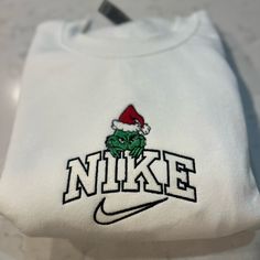 Not Nike Brand Please Allow Up To A Week To Ship Design Size Is 7x5 -Unisex Sizing True To Fit -Embroidered Design -Use Gildan Brand For Crewnecks, However There May Be A Substitute For A Similar Brand -Available In S, M, L, Xl, 2xl Size Of Design Is The Same For All Sizes Of Crewnecks So Design Will Look Smaller On A 2xl Compared To A S Material Is 50/50 Cotton/Polyester *Colors May Vary Slightly* Grinch Sweatshirt, Green Cropped Hoodie, Black Crop Sweatshirt, Embroidered Nike, Oversized Long Sleeve Shirt, Gap Sweatshirt, North Face Pullover, Ship Design, Christmas Graphic