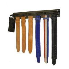 four pairs of leather watch straps hanging on a rack with ties attached to the wall