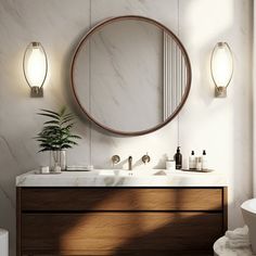 a bathroom vanity with two sinks and a round mirror above it, along with a bathtub