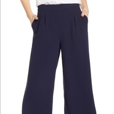 In And Of-The-Moment Cropped And Wide-Leg Silhouette, These Seasonless Crepe Pants Are Ideal For Travel Or Wearing Repeatedly. Casual Business Wide-leg Pantsuit, Chic Navy Bottoms For Formal Occasion, Chic Navy Formal Bottoms, Chic Navy Wide Leg Workwear Pants, Chic Navy Wide Leg Pants For Work, Chic Blue Wide Leg Pants For Business Casual, Chic Navy Bottoms For Office, Chic Navy Straight Pants, Casual Navy Pants For Office