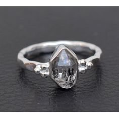 This Ring is handcrafted in Solid 925 Sterling Silver with Natural Raw Herkimer Diamond gemstone, It is free from lead and nickel to prevent from any type of skin allergies. Product: Ring Metal/Material: 925 Silver Gemstone: Herkimer Diamond Stone Type: Raw gemstones Stone size: 7x10 mm approx. Stone shape: Fancy Weight: 4.5 gram approx. Birthstone: April Ring Sizes: 5  to 12 US. Select on drop down Stone Setting: Bezel Stone Color: Black/white Finishing: Shiny silver             Gemstone Properties: Herkimer Diamonds helps with healing because of its brilliance and clarity. Believed to receive and magnify the influence of other stones and energy. Helps with research and study as this stone is believed to store knowledge. Healing effects : Wear this stone to help balance polarity such as w Heirloom Style Moonstone Ring In Sterling Silver, Heirloom White Gold Moonstone Ring In Sterling Silver, Heirloom Moonstone Ring In White Gold And Sterling Silver, Unique White Topaz Round Rings, Silver Sterling Silver Diamond Ring Oval, Sterling Silver Ring With Bezel Setting Gift, Silver Moonstone Ring With White Topaz For Anniversary, Sterling Silver Rings With Bezel Setting As Gift, Silver White Topaz Ring