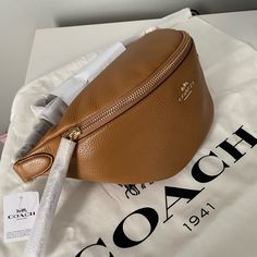 Authentic Sold Out In Stores And Online Pebble Leather One Credit Card Slot Zip Closure, Fabric Lining Adjustable Strap For Wear At Waist 14 1/4" (L) X 5" (H) X 4 1/4" (W) New With Tags Price Is Not Negotiable Dust Bag Not Included Brown Coach Saddle Bag With Removable Pouch, Coach Orange Bag With Detachable Strap, Brown Coach Shoulder Bag With Removable Pouch, Coach Belt Bag, Coach Orange Crossbody Shoulder Bag, Coach Parker, Coach Shoulder Bag With Removable Pouch For On-the-go, Vintage Coach Bags, Coach Belt