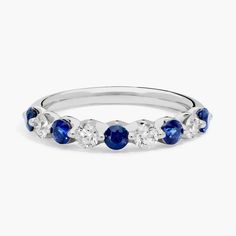 a white gold ring with blue sapphire and diamonds