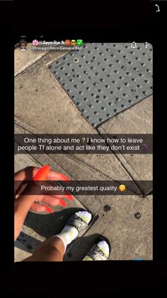 someone is trying to fix their shoes on the sidewalk, and then they have to remove them