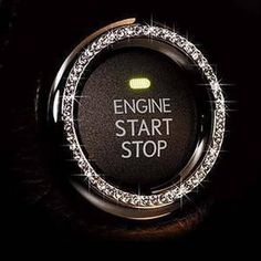 an engine start button with the words stop written on it in white letters and sparkles