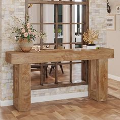 a wooden table sitting in front of a mirror on top of a hard wood floor