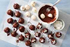 chocolate truffles with coconut flakes and spoon on napkin next to bowl of marshmallows