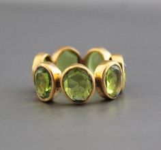 ♦♦ Beautiful handcrafted ring  ◘Stone Information:     Peridot quartz -     Color: Green  ◘ Metal: 925 Sterling Silver ◘ Setting: Open back bezel setting ◘ Finish: High polish (shiny) ◘ Nickel free  ◘ Anti tarnish ◘ Handmade band: 14 gauge solid sterling wire    This ring is adorably rustic, easy to wear, & stackable! ◘Please Note - The Ring in the Picture can be available or  Sold out. Every  Ring is Made of a     Unique Gemstone. Therefore, Colors and Inclusions of the Stone may Vary. I will Choose the     best Quality Gemstone for You.  ◘ WHOLESALE  ENQUIRIES ARE ALSO WELCOME  ◘ WORLDWIDE SHIPPING  I manufacture all kind of gold and silver jewellery with my team and create each and every piece   with love and care. But in case for any reason if you are unhappy with anything regarding th Round Peridot Stone Jewelry, Round Peridot Jewelry With Stones, Quartz Color, Quartz Colors, Green Metal, Etsy Gold Ring, August Birthstone, Ring Stone, Peridot Gemstone