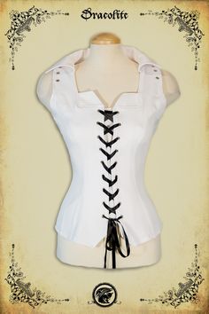 a woman wearing a white corset with black laces on the front and sides