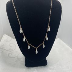 "Class pearl drop necklace with non tarnish gold fill.  I used 7 pearls that are  4.5mm x 8 mm long.  These are rice shaped pearls- added a touch of 2.5 mm gold filled beads on top of each.  I spaced them 3/4\" apart for the best drape. You choose between 16, 17 or 18 inches long in options. This is a beautiful necklace on its own or as a layering piece.  Perfect Spring  gift for you or someone you love! The drop pearl earring is a separate listing." Gold Dangle Charm Necklace With Pearl Drop, Minimalist Teardrop Pearl Chain Drop Necklace, Gold Teardrop Pearl Charm Necklaces, Gold Teardrop Pearl Drop Necklace, Gold Teardrop Pearl Necklace, Gold Teardrop Charm Necklace With Pearl, Gold Dangle Drop Necklace With Pearl Chain, Gold Dangle Necklace With Pearl Drop, Gold Drop Necklaces With Pearl Charm