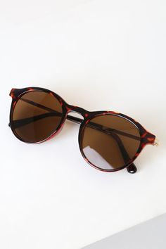 Walk around the city in style with the Lulus Fare Tortoise Round Sunglasses! Classic round tortoise frames, with shiny gold arms, hold brown-tinted lenses. Gold trim travels along the top of the frames for a luxe finishing touch. Frames Measure 5. 5" Wide. Arms Measure 5. 75" Long. Man Made Materials. Imported. Lulus | Fare Tortoise Round Sunglasses. Brown Mirrored Cat Eye Sunglasses With Round Frame, Brown Mirrored Sunglasses For Travel, Brown Cat Eye Sunglasses With Mirrored Lenses, Brown Mirrored Cat Eye Sunglasses, Brown Mirrored Lenses Cat Eye Sunglasses, Brown Cat Eye Sunglasses With Tinted Round Frame, Brown Cat Eye Sunglasses With Tinted Lenses, Brown Tinted Cat Eye Sunglasses With Round Frame, Brown Round Frame Sunglasses With Mirrored Lenses