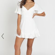 White Mini Dress, New With Tags, Never Worn. Size 10 Australian, Medium In Us Sizes. No Stains Or Flaws. Would Be Perfect For Graduation, Bridal Showers, Ect. - Made With 65% Cotton 35% Polyester & Love - Fully Lined 65% Cotton 35% Polyester - Care For Me; Line Dry In Shade Do Not Tumble Dry, Cold Iron - Length; 79cm/ 31.1in - Metal Invisible Zipper On The Center Back White V-neck Sundress, Fitted Flutter Sleeve Flirty Dress, Flirty Fitted Dress With Flutter Sleeves, White V-neck Mini Dress For Spring, Fitted Flirty Mini Dress With Flutter Sleeves, Chic Flutter Sleeve Lined Dresses, Fitted Flutter Sleeve Dress For Brunch, White Mini Dress For Summer Date Night, Summer Flutter Sleeve Dress For Date Night