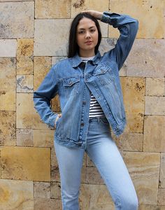 Vintage blue jean jacket in a mid wash denim. Boyfriend style. Two chest pockets. Size medium, UK 10-14 / EU 38-42. Measurements - 40"(102cm) bust - 26"(66cm) sleeve length - 25" (64cm) jacket length. Material - Denim. Condition - Good, wear to arm as shown . Handpicked, repaired and ready to wear. This is an original vintage item, not new and minor signs of wear & age are expected, we will highlight any major flaws. Model is a UK 6/8 and is 5'7" tall Fall Medium Wash Recycled Denim Jacket, Light Wash Relaxed Fit Denim Jacket In Recycled Denim, Relaxed Fit Denim Jacket In Recycled Denim, Light Wash Relaxed Fit Recycled Denim Jacket, Relaxed Fit Light Wash Recycled Denim Jacket, Relaxed Fit Medium Wash Recycled Denim Jacket, Recycled Denim Light Wash Long Sleeve Jacket, Spring Medium Wash Recycled Denim Jacket, Dark Wash Recycled Denim Jacket