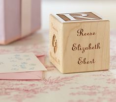 a wooden block with the words please elizabeth and sleet on it sitting on a table