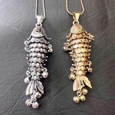 # Product Description: -    Brand Name: VISHWAS JEWELS    Size:  Length: 7 cm approx.               Width: 2 cm approx.    Material: Brass     Purity: Natural material    Stone: Zircon      Shape\pattern: Movable Fish Necklace      Weight: 22 g approx.    Payment Mode: PayPal, Payoneer    Shipping: DHL, FedEx, UPS  Product can be customized on request and gemstone can be made to any gemstone you want.  # Packaging & Delivery: -    Packaging Detail: Each piece is packed in plastic poly bags indiv Traditional Fish-shaped Jewelry For Gift, Traditional Fish-shaped Jewelry Gift, Vintage Silver Fish-shaped Jewelry, Handmade Silver Fish-shaped Necklace, Articulated Fish, Fish Necklace, Fish Pendant, Poly Bags, Shape Patterns