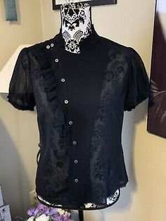 All Saints Black Sheer Button Front 100% Silk Blouse Sz 6 | eBay Gothic Fitted Tops For Workwear, Spring Season Gothic Formal Tops, Vintage Black Office Tops, Vintage Black Office Top, Black Gothic Short Sleeve Blouse, Fitted Short Sleeve Gothic Blouse, All Saints, Silk Blouse, Fashion Inspo