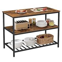 a table with two shelves holding food and plates on top of it, next to a toaster oven