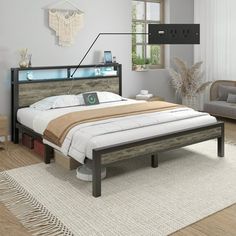 a large bed sitting on top of a wooden floor