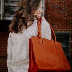 This tote will float your boat! Extra comfortable padded rolled handles and an interior loaded with convenient secure pockets. Details 100% Full-grain leather handcrafted by artisans in South America and India. Every hide is unique so you will notice natural variations in the grain texture and shading which are hallmarks of high-quality. Can accommodate up to 15" laptop Large, single compartment Shoulder Bag w/ top snap closure Fully lined interior with organizer, 2 zip pockets, phone pocket, an Eco-friendly Rectangular Leather Bag, Textured Leather Tote Satchel For On-the-go, Festival Tote Bag, Black Textured Leather Tote Satchel, Artisan Leather-lined Tote Shoulder Bag, Dark Tan Leather-lined Tote Bag, Pockets Details, Float Your Boat, Design Essentials