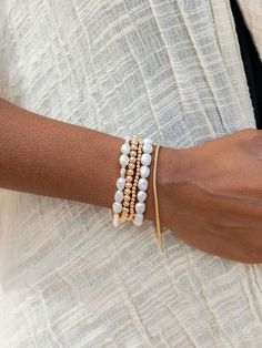 "Beautified with an assemblage of lustrous white freshwater pearl beads, this 18k gold filled pearl bracelet alludes to the soothing sands of Hawaii's shores. Wear this gold pearl bracelet alone or stacked for a classically elegant look. ✦ DETAILS ✦ ✧ Name: Hiwahiwa (HEEvah HEEvah) - precious, beloved, indulged. ✧ Adjustable Length from: 7\"-8.5\". ✧ White Freshwater Pearls. ✧ 14kt Gold Filled Components, Extender, and Clasp. ✧ All Ke Aloha Jewelry pieces come packaged thoughtfully, beautifully, White Jubilee Stretch Bracelet, Adjustable White Pearl Bracelets, Adjustable Single Strand White Bracelet, White Jubilee Stretch Bracelet Bangle, White Jubilee Bangle Stretch Bracelet, White Jubilee Bracelet Bangle, Elegant Faceted Beads Bracelets For Beach, White Single Strand Bracelet As A Gift, White Single Strand Beaded Bracelet For Gift