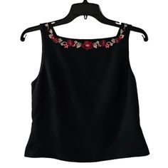 Beautiful Black Structured Sleeveless Top. Delicate, Yet Eye-Popping, Floral Embroidery Along The Square Front And Back Neckline Adds A Whimsical Detail To This Classic Little Black Top. I Purchased This Top As A Set To Wear With The Red Blazer And Skirt (And Soon-To-Be-Listed Red Pants) In My Closet. It's Versatile And Made Of High-Quality, Structured Material. Can Be Worn Casually For Work Or Dressed Up For A Cocktail Party, Wedding, Or Other Formal Occasions. Brand: Petite Sophisticate Color: Fitted Floral Embroidery Tank Top, Fitted Tank Top With Floral Embroidery, Fitted Floral Embroidered Tank Top, Fitted Floral Embroidered Sleeveless Tank Top, Fitted Sleeveless Blouse Tank Top With Floral Embroidery, Elegant Embroidered Sleeveless Vest, Black Floral Embroidery Sleeveless Vest, Sleeveless Floral Embroidered Party Top, Formal Sleeveless Embellished Top