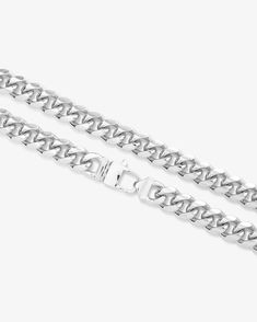 For him, for her, for everyone. A Cuban style chain, with its oval interconnected links, has been a timeless staple in the jewelry boxes of both men and women for years. The larger of our two Julian chains, the Julian Cuban Chain Necklace in 10.8mm is large enough to stand on its own and show you why a Cuban chain is a forever classic.DETAILS: Cuban Chain Necklace Available in Lengths: 18”, 22" or 24" Width: 10.8mm Signature MM Padlock Clasp SKU: N6233 MATERIALS:Silver Plated Over Brass Modern Necklace With Solid Cuban Link Construction, Classic Curb Chain Necklace With Rectangular Links, Classic Cuban Link Necklace With Oval Links, Classic Cuban Link Necklace With Chunky Chain, Cuban Link Necklace With Oval Links As Gift, Silver Cuban Link Necklace With Chunky Chain, Oval Link Cuban Necklace With Solid Construction Gift, Cuban Link Necklace With Oval Links For Gift, White Gold Cuban Link Necklace With Chunky Chain