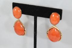 -Vintage 14k Gold Natural Japanese Momo Orange Red Coral Earring -Total length: 2 in -Round coral size: 16.5 mm x 12.4 mm -Tear drop coral size: 24.65 mm x 17.5 mm x 7.6 ( thickness ) -Total weight: 17.9 g -Tested 14k Formal Coral Jewelry With Cabochon Details, Formal Coral Jewelry With Cabochon, Luxury Coral Jewelry For Formal Occasions, Formal Orange Gemstone Earrings, Elegant Coral Earrings For Formal Occasion, Formal Coral Oval Jewelry, Elegant Coral Jewelry For Anniversary, Elegant Orange Earrings For Formal Occasions, Orange Clip-on Earrings For Formal Occasions