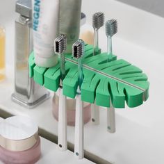 PRICES MAY VARY. Toothbrush holder for bathroom made of EVA sponge, durable and convenient. Self adhesive toothbrush hanger suits for smooth surfaces, such as wood, tile, ceramic, metal, plastic. Multipurpose toothbrush holder easy to install or remove, no need to nail or drill, without surface damage. The wall mounted toothbrush holder could not only be the toothbrush holder, also a plug holder, towel, etc. Package Contents: Wall mount toothbrush holder x 1  Product Size: 7.5" x 2" x 0.8" (19 x Small Bathroom Toothbrush Storage, Cute Bathroom Decor Apartment, Bathroom Decor Items, Cute Bathroom Towels, Green Toothbrush, Wall Toothbrush Holder, Bathroom Toothbrush Storage, Toothbrush Organizer, Tooth Brush Holder