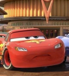 two cars are parked in front of a building with the characters from disney pixama