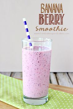 a banana berry smoothie in a glass with a straw