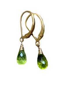 Small Green Peridot Stone drops Earrings. Peridots dangles. Natural peridot jewelry. Gold fill leverbacks. August birthday. Beautiful, soft green, natural stones in a faceted briolette shape wire wrapped to goldfill leverbacks. The earrings are 1 inch long, each stone is 8 x 6 mm. Petite earrings. Perfect for every day. Great as a gift for bridesmaids, convo for a discount. Available in 14k gold fill, Rose goldfill, sterling silver and oxidized silver. The earwire can be changed to a different o Green Briolette Earrings For Anniversary, Peridot Drop Earrings For May Birthstone, Peridot Dangle Earrings For May Birthstone, Teardrop Peridot Jewelry For May Birthstone, Peridot Dangle Earrings With Ear Wire, Gold Teardrop Peridot Earrings, Green Peridot Teardrop Earrings, Green Peridot Dangle Earrings, Peridot Teardrop Earrings For May Birthstone