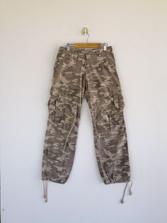 Japanese Cargo Pants Camouflage Multipocket Trousers - BS46186. Manual Measurement (Laying Flat): 1) Waist: 27 inch. 2) Rise: 8.5 inch. 3) Hip: 19.5 inch. 4) Tight: 11 inch. 5) Outseam: 36 Inch. 6) Inseam: 28 Inch. 7) Leg Opening: 8 inch. Please check measurements to insure a proper fit. Remember to allow yourself some extra room for movement. You can compare these with something from your closet that fits you well. Condition: Good Vintage Condition. Fabric Material: 100% Cotton. BS46186. We do Camouflage Straight Leg Parachute Pants With Cargo Pockets, Straight Leg Camouflage Parachute Pants With Cargo Pockets, Camouflage Straight Leg Cargo Parachute Pants, Khaki Full-length Combat Pants, Khaki Combat Full-length Pants, Military Style Full-length Cargo Jeans For Streetwear, Khaki Full Length Combat Pants, Khaki Full Length Combat Cargo Pants, Khaki Combat Cargo Pants